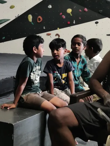 A quiet moment of connection and conversation with our young climbers. Coaching is about more than just technique; it's about building trust and mentoring the next generation.