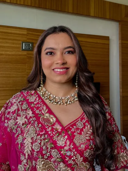A happy and radiant smile from this beautiful client. Her makeup is designed to look just as good when she is smiling and laughing as it does in posed photos.
