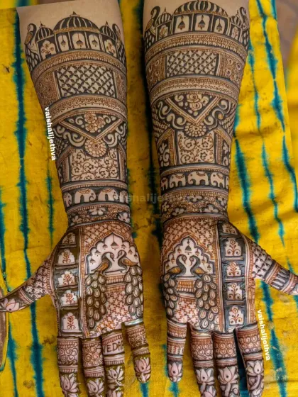 A royal Rajasthani story in henna. This design is filled with palace architecture, graceful peacocks, and elephants, creating a majestic look perfect for a bride.