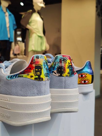 Some of the custom pairs I painted on display at the Adidas live event, including these Stan Smiths with a Basquiat-inspired design on the heel.