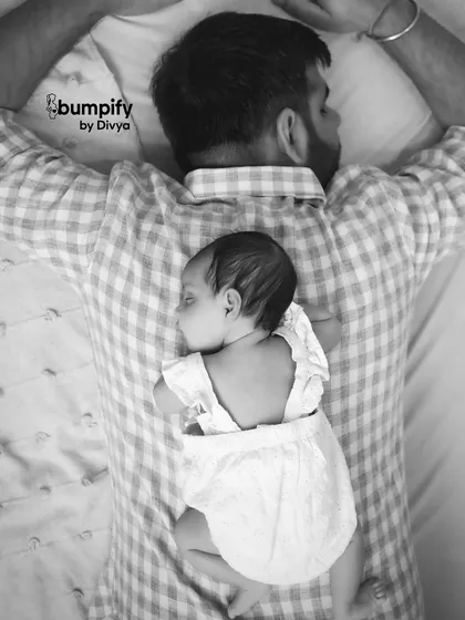 The first few weeks are so precious and fleeting. This quiet moment of a newborn sleeping peacefully on her father's back is a powerful reminder of that incredible, new bond. These are the memories that become your family's story.