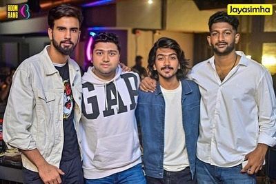 A group of guys enjoying the music and the atmosphere.