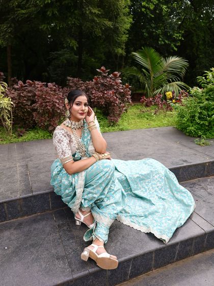 The complete look from head to toe, including the stylish block heels that go well with the modern saree.