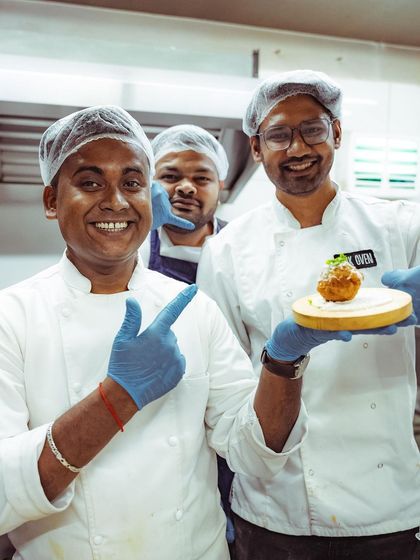 Our chefs proudly presenting one of their innovative creations at a wine-tasting event. We love to experiment and go beyond our standard menu.