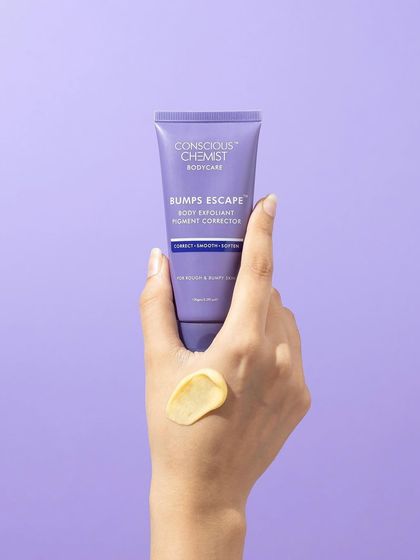 A simple hand model shot that showcases the product and its texture. The swatch on the back of the hand gives a realistic idea of the product's consistency, while the purple background makes the packaging pop.