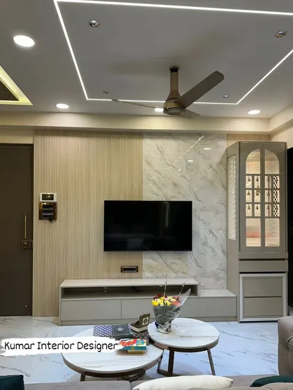 A final look at the living room, showing the integrated TV unit and pooja mandir, a perfect example of our end-to-end turnkey interior solutions.