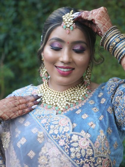 A close-up shot showcasing the beautiful eye makeup and perfectly placed maang tikka. My students learn to master these details.