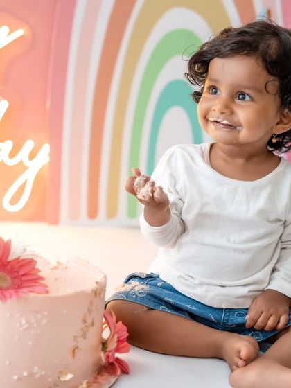 A happy smile from the birthday girl after enjoying her cake, a perfect end to a fun session.