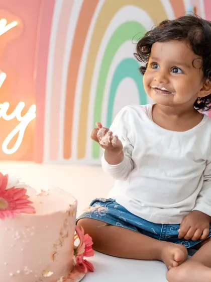 A happy smile from the birthday girl after enjoying her cake, a perfect end to a fun session.