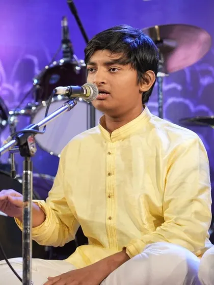 Student Hari Kishan K singing an Annamacharya Keerthana with deep involvement.