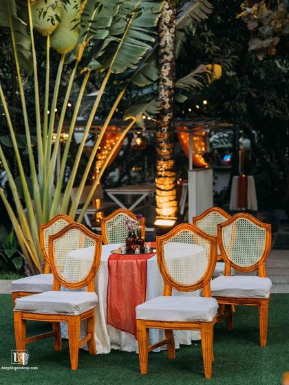The perfect setting for a pre-wedding cocktail party or sangeet night. The lawn provides ample space for a dance floor, while the surrounding trees, lit with elegant chandeliers and string lights, create a festive and celebratory atmosphere.