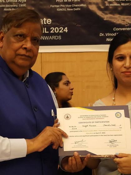 Our mentor, Ms. Kanika, receiving a certificate of participation at an education and training event. We actively participate in industry events to share our expertise and learn from others.