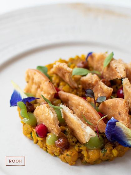 A detailed shot of the Khasta Matar Chaat, garnished with edible flowers. It was a refreshing and modern take on a classic street food.