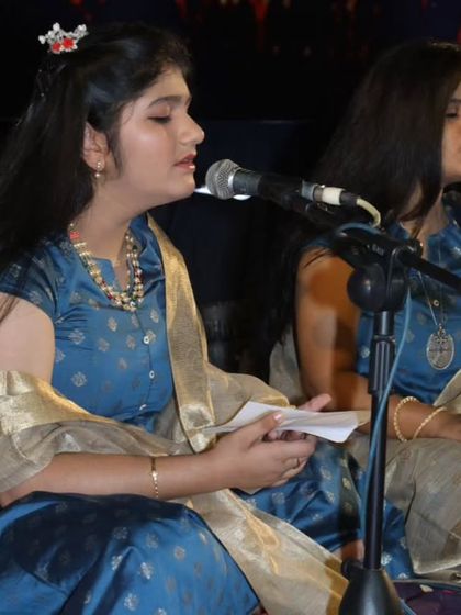 Two of our Hindustani vocal students singing in unison, demonstrating the harmony achieved through our training.