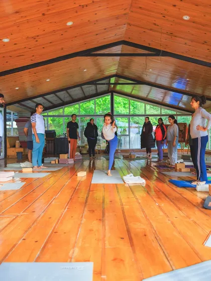 Demonstrating Utthita Hasta Padangusthasana (Extended Hand-to-Big-Toe Pose) to the class. Balance poses teach us focus and stability.
