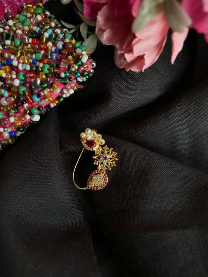 Another view of the American Diamond nath, showing its intricate design.