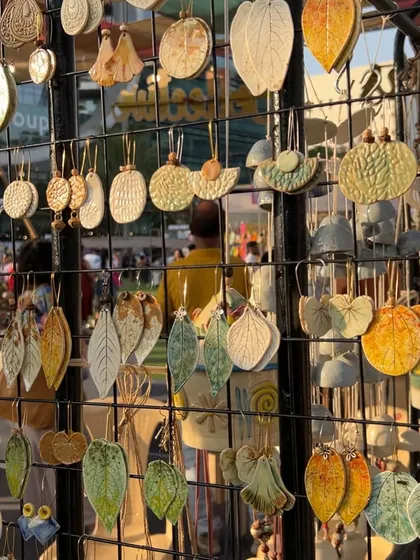A display of my leaf-shaped earrings at The Lil Flea. I use real leaves to create the impressions, so each pair captures the unique details of nature.