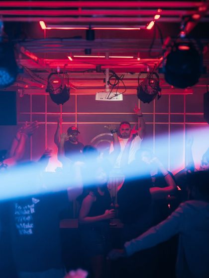 A beam of light cuts through the crowd during our set.