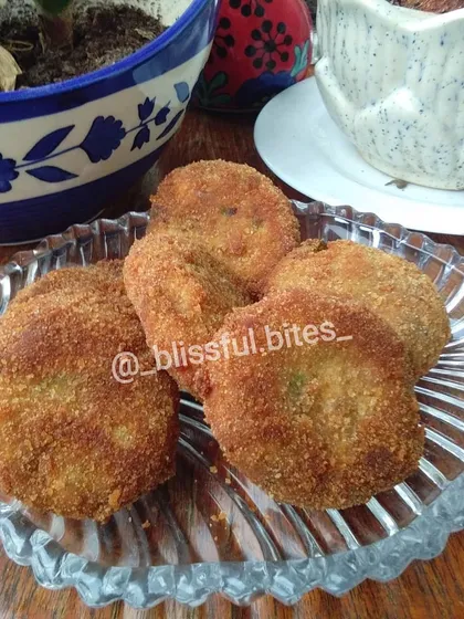 A serving of my homemade Malai Kebabs, showcasing their perfectly round shape and crispy coating. They are a great example of my savoury chicken snacks.