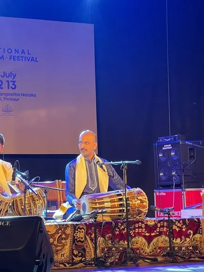 In a high-energy 'Jugalbandi' or percussion duet with the talented Sukhad Munde on Pakhawaj at the National Rhythm Festival in Kerala. These rhythmic dialogues are always a thrill.