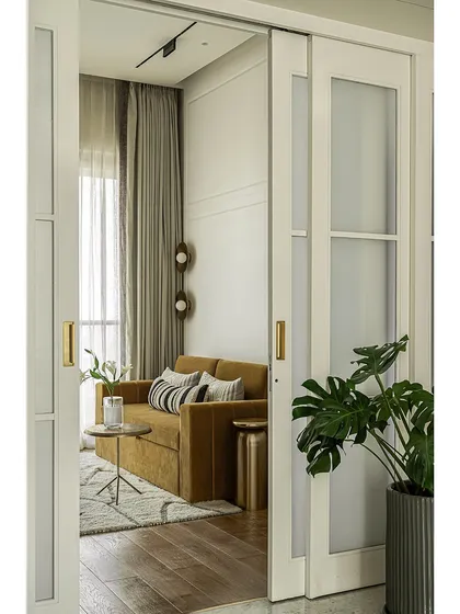 Another perspective of the den, showing how the space is perfect for both relaxing and hosting. The hand-painted details on the wardrobes add a touch of character and warmth.