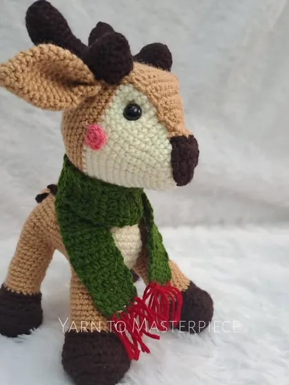 A side view of the reindeer, showing his rosy cheeks and sturdy construction.
