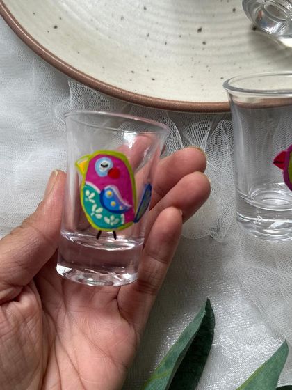 A closer look at one of the hand painted bird shot glasses. Each bird has its own unique design and personality.