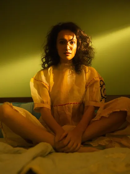 I love creating a mood that feels like a scene from a film. Here, a single, sculpted light source creates a dramatic sunbeam effect on actress Dipannita Sharma, capturing a moment of quiet introspection.