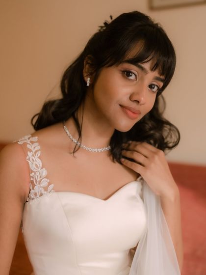 Shruti's happy, candid moment. Her makeup was designed to look fresh and natural, allowing her to feel comfortable and confident.