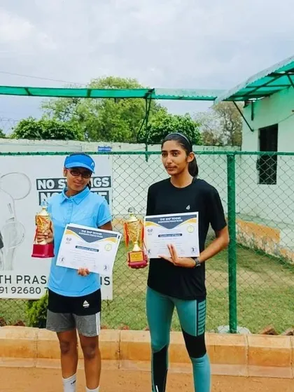 Two competitors, including our player Khushi Sharma, with their trophies and certificates after the CS7 U-14 tournament finals.