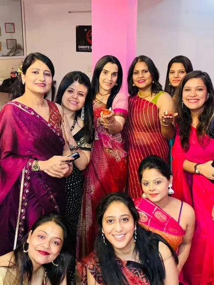 Shining bright with diyas during our Diwali celebration. The studio provides a safe space for festive rituals.