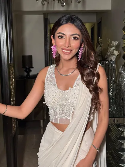 A happy, smiling portrait. The makeup is designed to look natural and radiant, making her feel comfortable and beautiful.