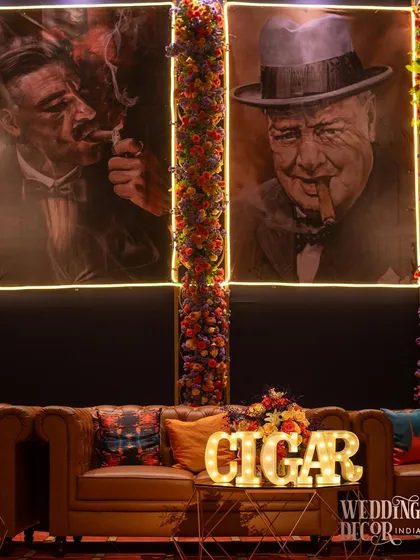 The dedicated cigar lounge sign, with marquee lights, adds a fun, vintage touch to this special corner of the party.