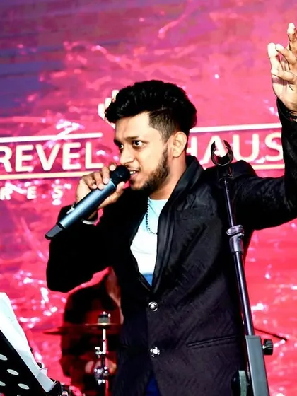 A shot of me leading the band at Revel Haus. With a full band, I can engage more with the audience, moving around the stage to connect with everyone in the room.