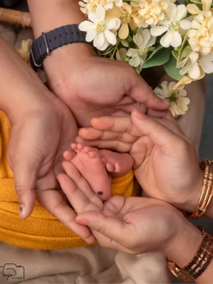 The world seems so big, and they are so wonderfully small. I focus on these tiny details, like parents' hands cradling their baby's feet, to create cherished images that celebrate this fleeting moment.