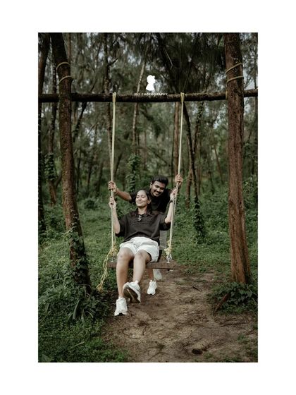 A playful moment on a swing in the woods. This type of pre-wedding shot is perfect for capturing a couple's fun and carefree side.