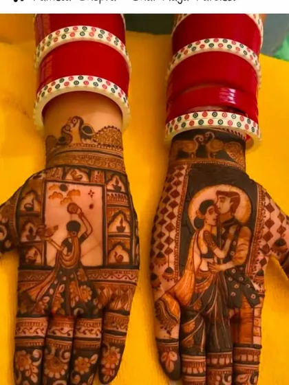 This Karwa Chauth portrait mehndi shows a bride with her 'chura' (bridal bangles) performing the rituals. The other hand features a romantic portrait of the couple.