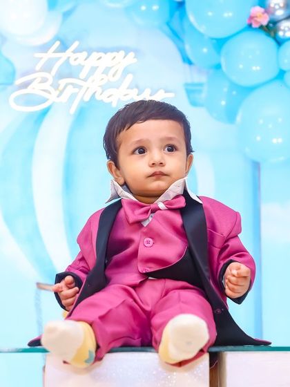 A vibrant 'Pokemon' themed birthday party, with character cutouts, a custom backdrop of the Kanto region, and red and white balloons, ready for a Pokemon battle.