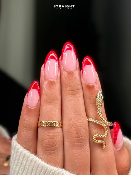 A close-up of the red croc-print French tips. The texture adds a unique and unexpected element to the design.