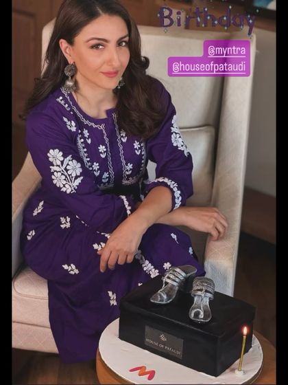 A chic and stylish shoebox cake for Soha Ali Khan's birthday, in collaboration with Myntra and House of Pataudi. The cake features a pair of realistic, edible silver heels on top of a branded shoebox.