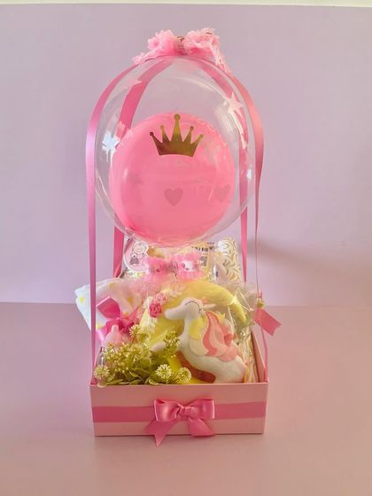 The balloon hamper is a stunning way to congratulate new parents. The pink balloon with a crown is a lovely touch for a baby girl.