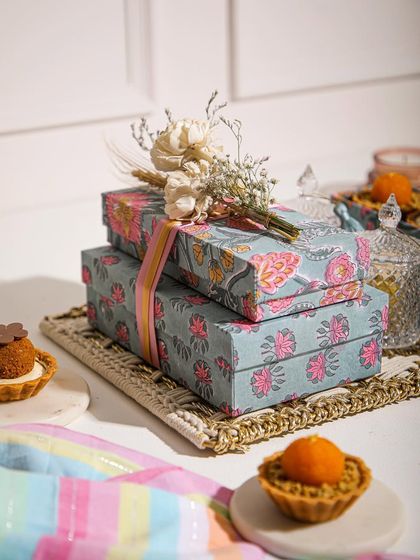 Wrapped in love, layered with sweetness. Our Rakhi special hamper, with its beautiful floral boxes, is designed to celebrate the bond of siblings.