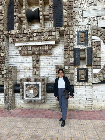 Standing before the intricate facade of the Delhi High Court. Every day in litigation is an effort to do your best and keep moving forward, fighting for your clients.