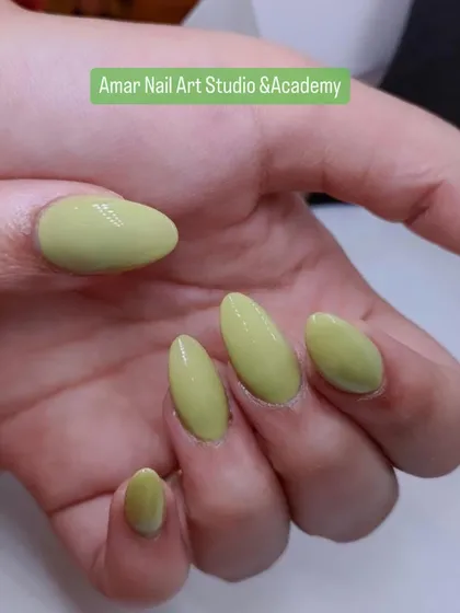 A simple and elegant set of solid-colored nails in a trendy pistachio green. This shows that sometimes, a single, beautiful color is all you need.