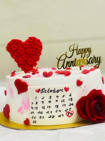 Another lovely anniversary cake with a calendar theme and a big red heart.