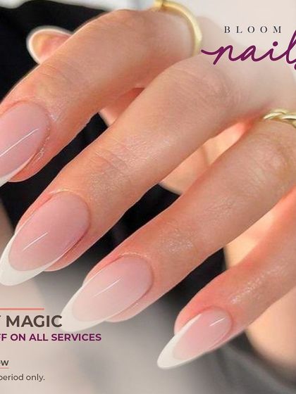 A classic, elegant French manicure on long, almond-shaped extensions. The lines are clean and the shape is perfect.