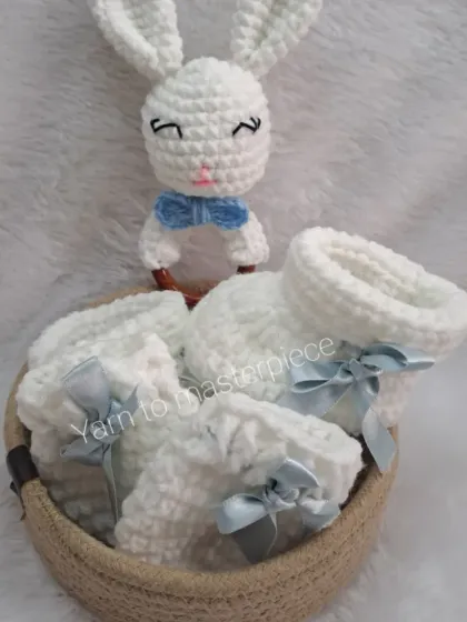 Another view of the blue and white bunny-themed gift hamper, showing the adorable bunny rattle and matching accessories tucked into a basket.