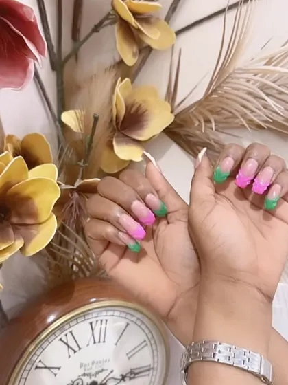 A full look at the vibrant pink and green French manicure, perfect for someone who loves to stand out.