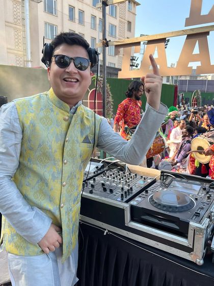 Pure Baraat madness. Pointing to the sky, feeling the incredible energy from the crowd and the dhol players.