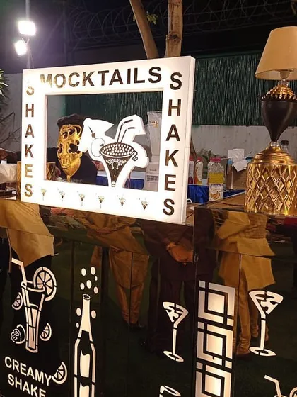 Our dedicated mocktail and shake bar, perfect for daytime events or for guests who prefer non-alcoholic options. The bar features custom lighting and signage, staffed by a professional bartender ready to mix refreshing drinks.